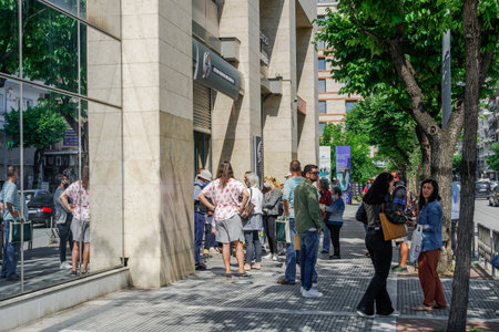 Thessaloniki, Greece Coronavirus measures affect daily life. Greeks keep distance outside DEI-Public...