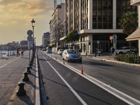 Thessaloniki, Greece - July 24 2020: New urban transport bikeway next to an asphalt road. Traffic only allowed to bicycles at marked bike path along the cycling infrastructure next to the waterfront.のeditorial素材