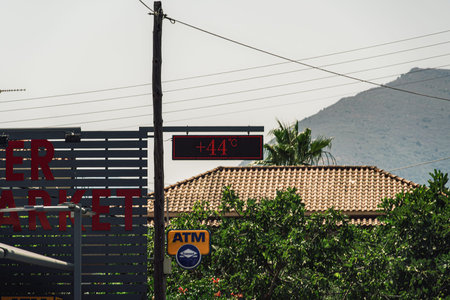Zakynthos, Greece - July 9 2021: Heatwave 44 degrees Celsius outdoors digital display. Hot...