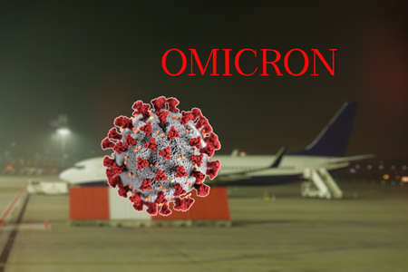 Omicron SARS mutation variant B.1.1.529 travel flying restrictions concept with title. COVID-19 virus illustration image against background of defocused grounded aircraft without passengers on runway.の写真素材