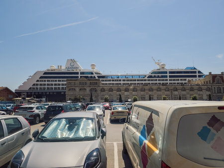 Thessaloniki, Greece - May 12 2022: Big cruise ship moored on the Mediterranean. Day sunny view of 180 meters long Azamara Pursuit on Makedonia Passenger Terminal at city port.のeditorial素材