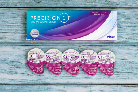Thessaloniki, Greece - April 12 2023: Silicon hydrogel one-day contact lenses in a saline package by Alcon, branded as Precision 1, with smart surface technology.のeditorial素材