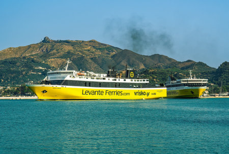 Zakynthos, Greece - July 09 2021: Mare di Levante and Fior Di Levante Ferries car passenger boats with distinctive colors and on a calm sea in the Ionian Islands.のeditorial素材