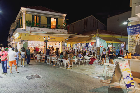 Lefkada, Greece - July 5 2021: night view of a pedestrian area with shops and crowd in the Ionian Island.のeditorial素材