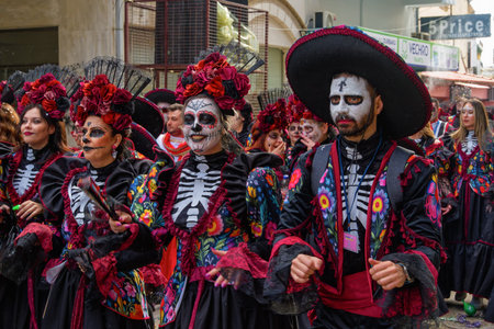 Xanthi, Greece - February 22 2026: Celebration with people in bright costumes. Participants dance and enjoy the festive atmosphere during the lively parade.のeditorial素材