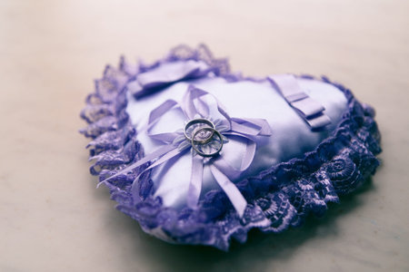 Weddings ring on the serenity pillow in the shape of heart