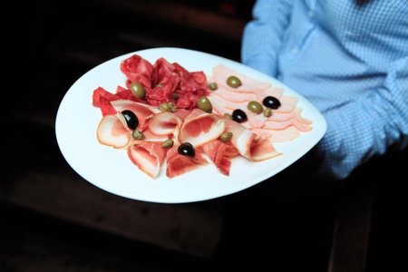 Plate of cold cuts with olives