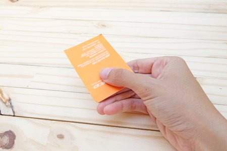 handling business Card on wood handの写真素材