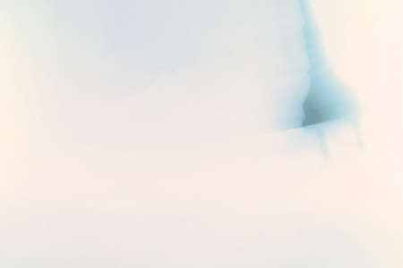 a moving swinging plug in black-blue tone backgroundの写真素材