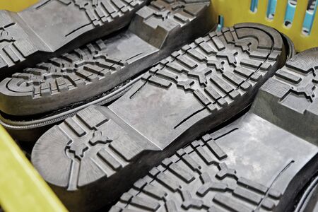 black shoes soles in yellow basketの写真素材