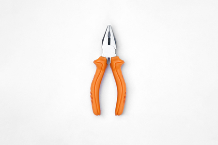 top view of wire cutter with orange color handle which on off-white backgroundの写真素材