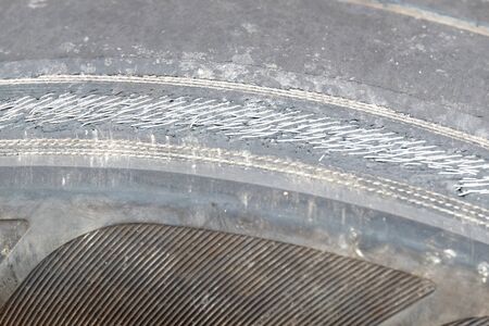 wire in a deteriorate tire (center of frame is selected focus)の写真素材