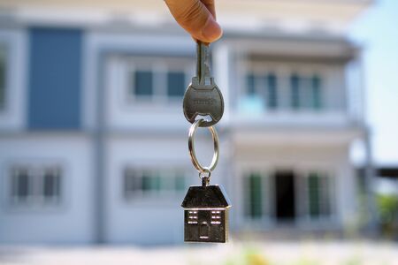 House key handle. Rent a house, buy and sell ideasの写真素材