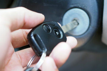 The car owner starts the car's engine.