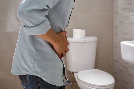 Men have abdominal pain. Want to shit. diarrhea conceptの写真素材