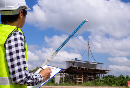 The inspectors or engineers are checking the work of the contractor team to build a bridge over the...