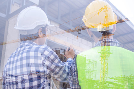 Engineers and contractors talk to the construction site or high-rise building. Construction of...