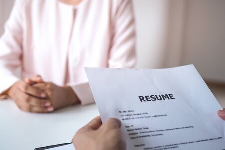 Executives holding the resume of the applicant. Business people interview job by asking about their background and attitude about the company. Changing jobs or getting a new positionの写真素材