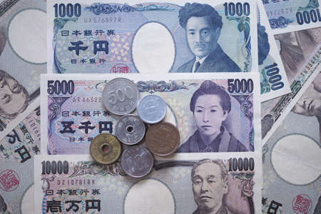 Japanese yen notes and Japanese yen coins for money concept backgroundの写真素材