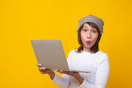 Female is surprised with the story seen in the notebook. Holding a notebook, stunned with what he...