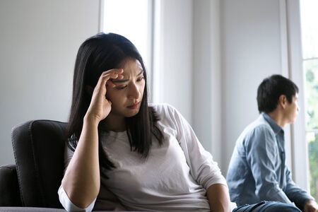 The woman felt depressed, upset and sad after fighting with her husband's bad behavior. Unhappy young wife bored with problems after marriage.の写真素材