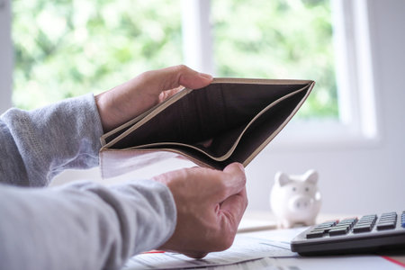 Debt burden to be paid. Error calculation of expenses, The butler is opening the wallet. No money is...