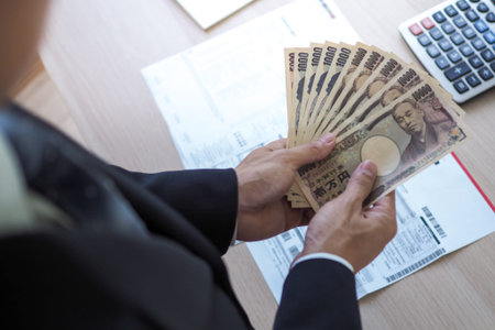 The boss was holding several thousand Japanese banknotes each. To pay as a welfare fund for employees in  the company. Japanese currency / Yenの写真素材