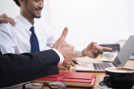 The management encourages employees to appreciate the work that is very good.の写真素材