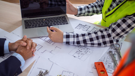 Picture of a meeting between the contractor and the owner of the construction project. Renovate of the new building structureの写真素材