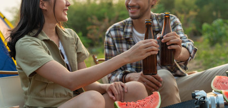 Love couple enjoying Camping Holiday In Countryside. Men and women are happy to eat and travel...