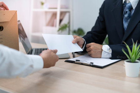 Businessmen send resignation letters to executives or managers. Include information about resignation and vacancies and job changes.の写真素材