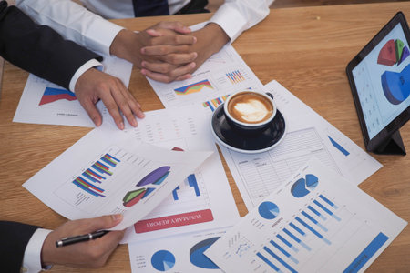 Business people brainstorming analysis charts, spreadsheets, financial development graphs, bank...
