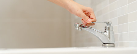 Save water. Volunteer keeps turning off the running water in the bathroom to protect environment....