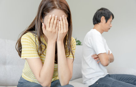 Divorce. Asian couples are desperate and disappointed after marriage. Husband and wife are sad, upset and frustrated after quarrels. distrust, love problems, betrayals. family problem, teenage loveの写真素材