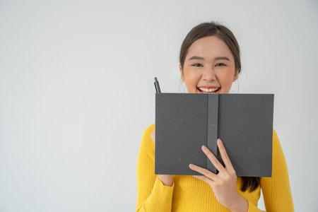 writer, writing ,creative ,recreation for imagine, Beautiful Asia attractive young woman writing ideas on notebook, to do list, good thinking work, journalist, Stylish, Dream image, relaxの写真素材