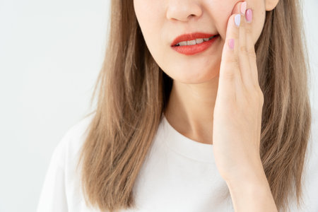 Asian woman feel toothache from gingivitis, female suffer tooth, decay problems, dental care. sensitive tooth, decay problem, bad breath, Gingival Recession, Oral Hygiene instruction, tooth extractionの写真素材
