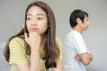 Divorce. Asian couples are desperate and disappointed after marriage. Husband and wife are sad, upset and frustrated after quarrels. distrust, love problems, betrayals. family problem, teenage loveの写真素材