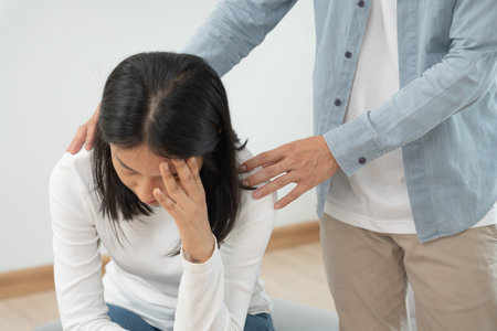 Couple support each while discussing family issues with psychiatrist. Husband encourages and empathy...