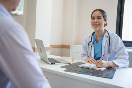 Asian female doctor advice consulting diagnosis and check-up at hospital clinic. Patient explain health problems and symptoms to Professional physician. medical, medicine, treatmenの写真素材