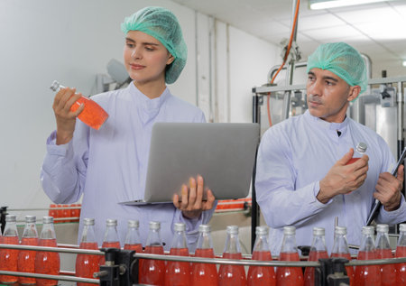 quality supervisor food or beverages technician inspection about quality control food or beverages before send product to the customer. Production leader recheck ingredient and productivity.の写真素材