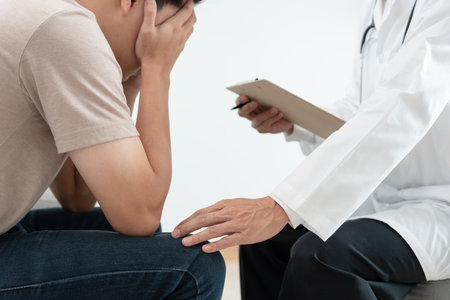man with mental health problems is consulting. psychiatrist is recording the patient's condition for treatment. encouragement, love and family problem, bipolar , depression patient, protect suicideの写真素材