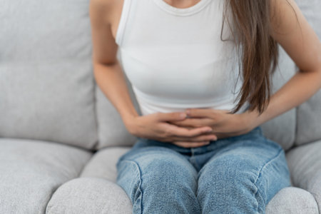 stomach ache. Asian women have abdominal pain, indigestion, gastritis, menstrual cramps, flatulence,...