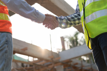 Construction worker team hands shaking greeting start up plan new project contract in office center...