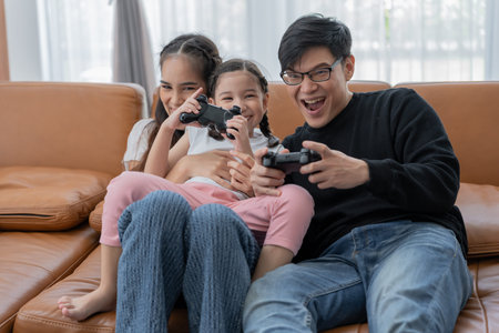 New home for family. Play game together during the holidays. Parents and children are having...