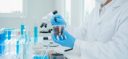 Scientist check chemical food residues in laboratory. Control experts inspect the concentration of...