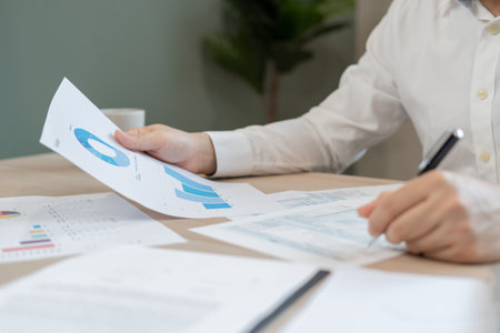 Business men calculate benefit, spreadsheets, graph financial development, bank accounts, statistics, economy, data analysis, investment analysis, stock exchange,Interest rates, incomeの写真素材