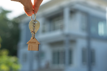lease, rental and selling home. Real estate agent manager smile holding key for new owner.  rent house, Sales, loan credit financial, insurance, Seller, dealer, installment,  buy, sell, move inの写真素材