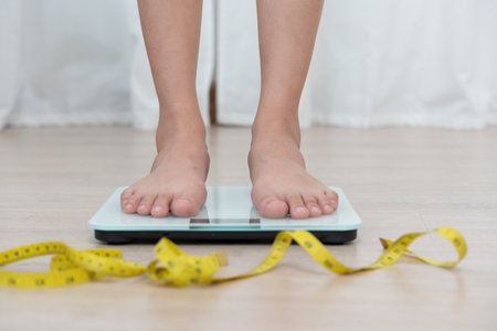 results of diet. Beautiful shape. female have a reduced waist size after under going a weight loss corse. can not wear jean due to weight loss. balance, control, routines, exercise.の写真素材