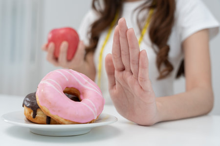 Beauty slim female body confuse fat food. Woman in restaurant achieves weight loss goal for healthy life, low calorie, thin waist, nutritionist. Diet, body shape, balance control, avoid, nutritionalの写真素材