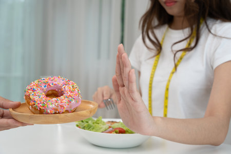 slim body asian women choose healthy foods, dieting female choose salad for diet. Good healthy food. weight lose, balance, control, reduce fat, low calories, routines, exercise, body shape.の写真素材